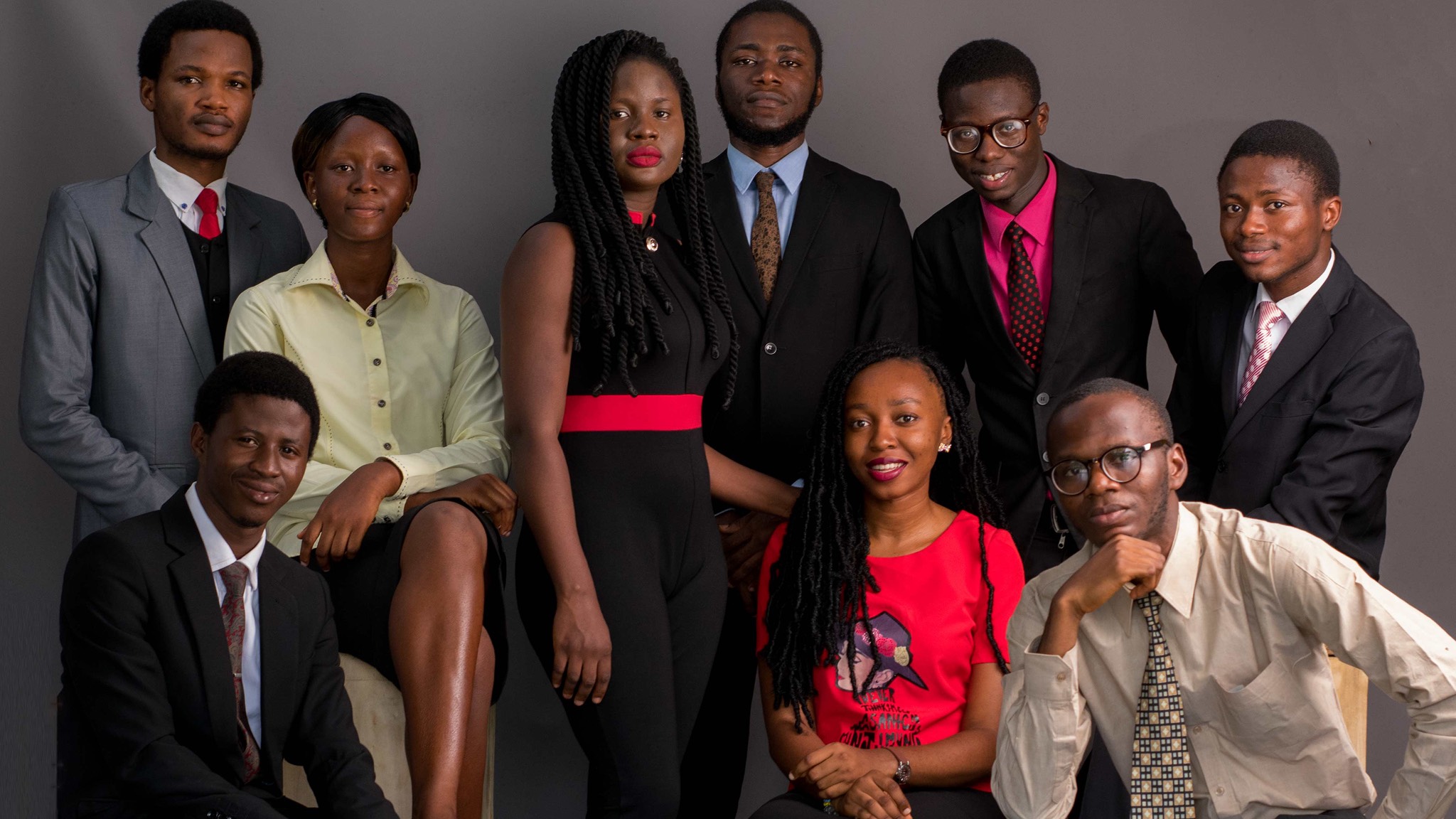 a group of young people posing for a photo.