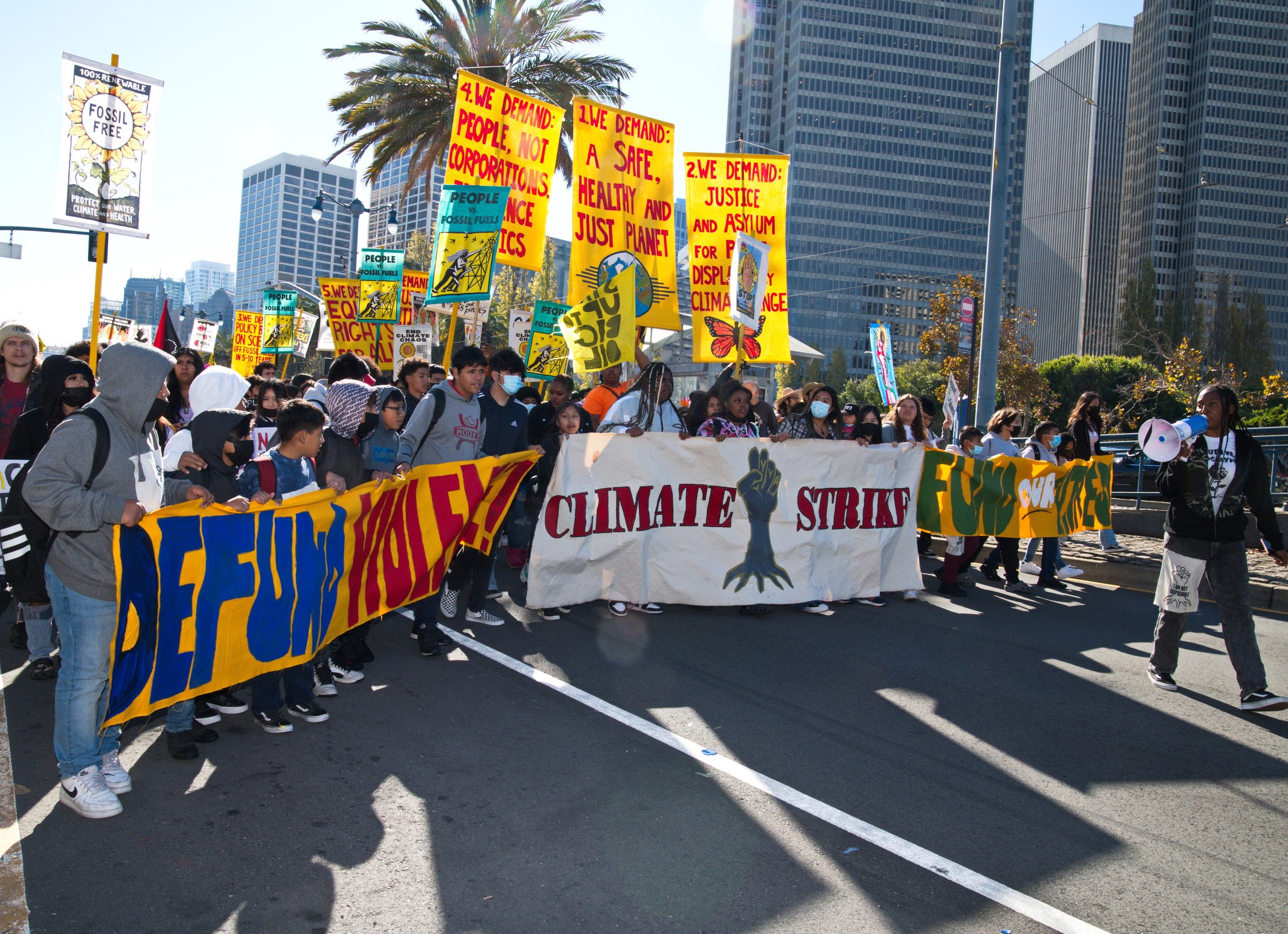 a group of people holding a banner.