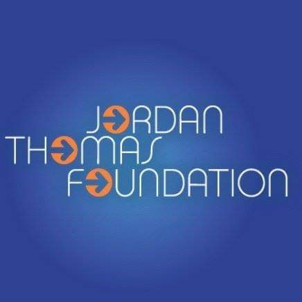 jordan thomas foundation logo on a blue background.